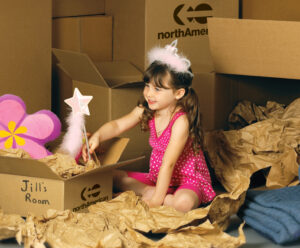 Child with moving boxes